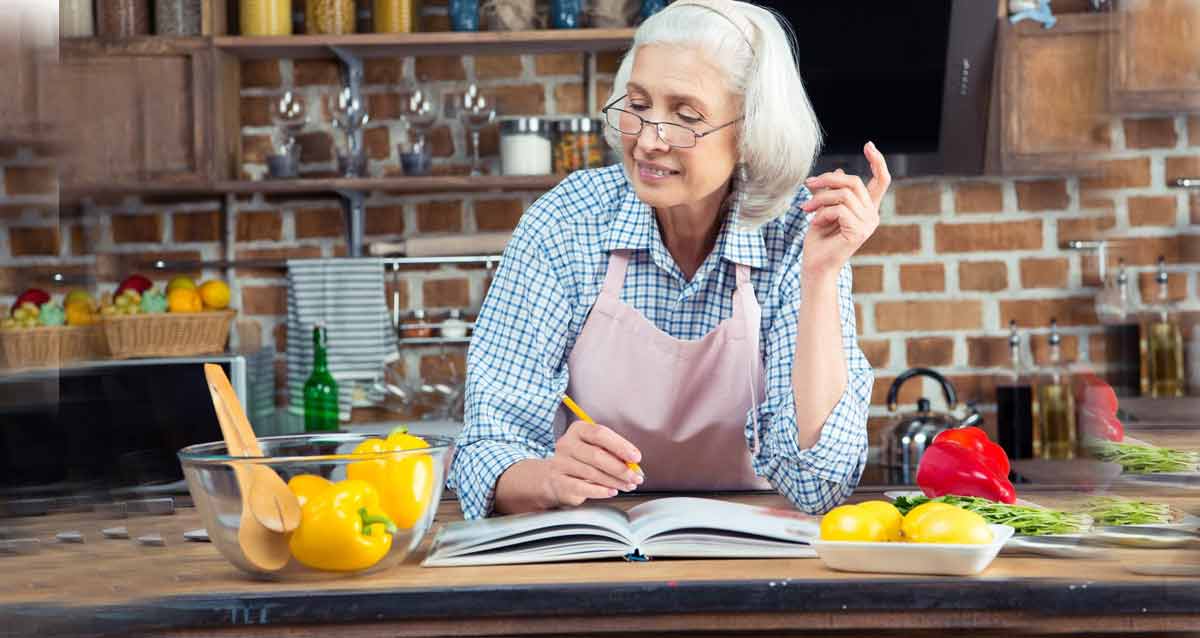 Older woman cooking in kitchen